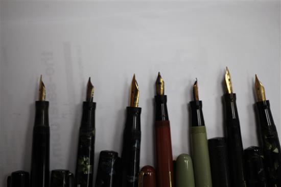 A collection of twenty Mabie Todd Swan fountain pens and a similar ejector pencil,